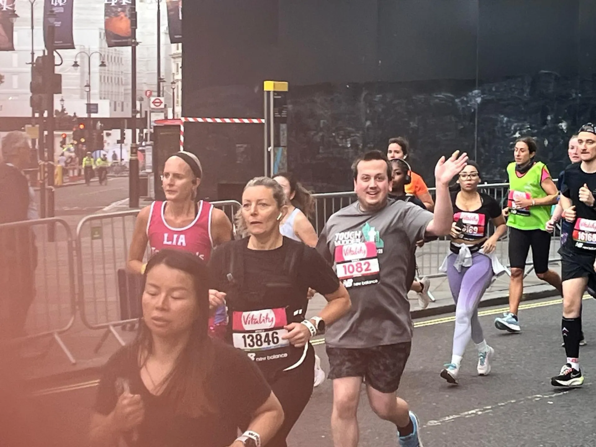 Eric, waving, as he runs past.