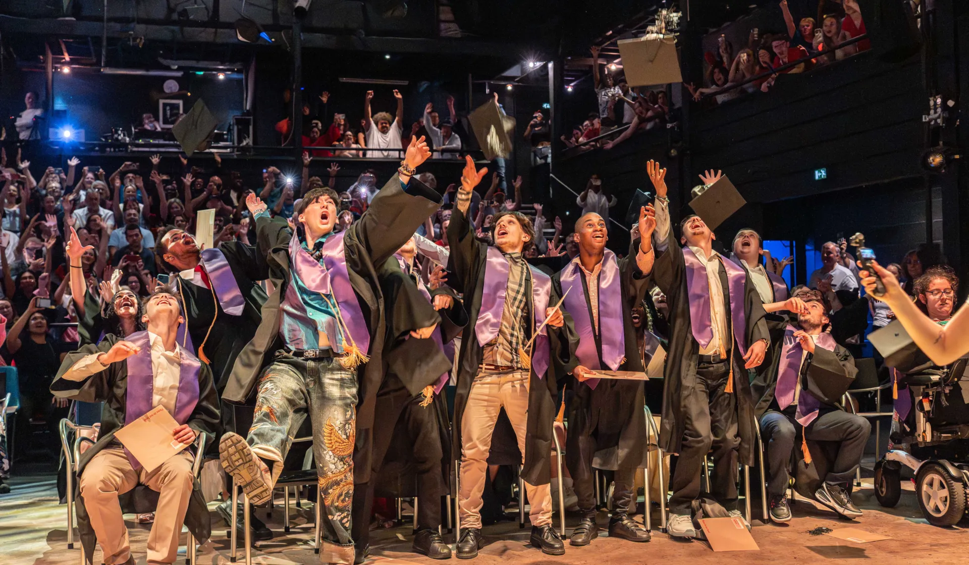 Students throw caps and celebrate graduating