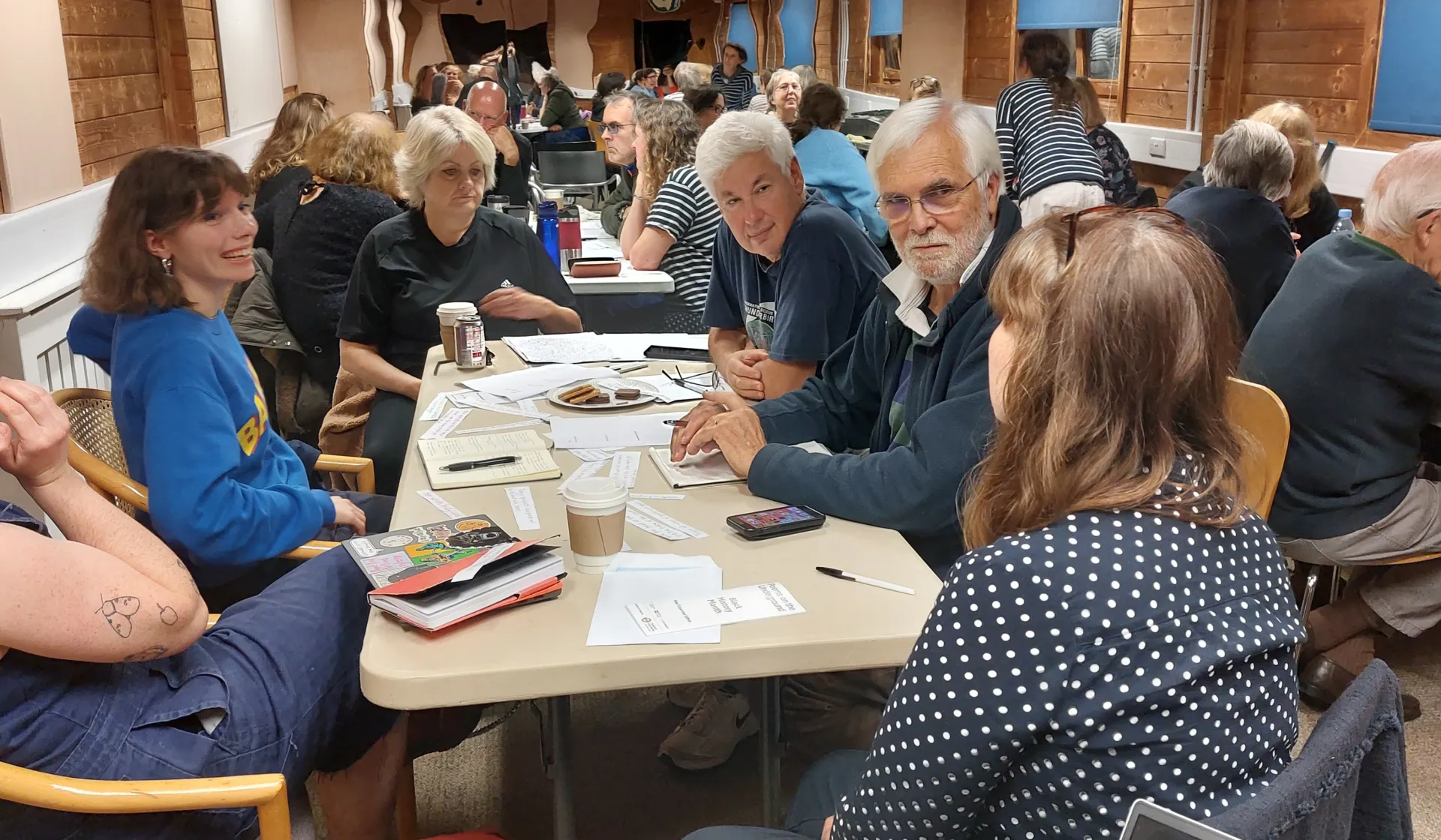 People sitting round tables talking