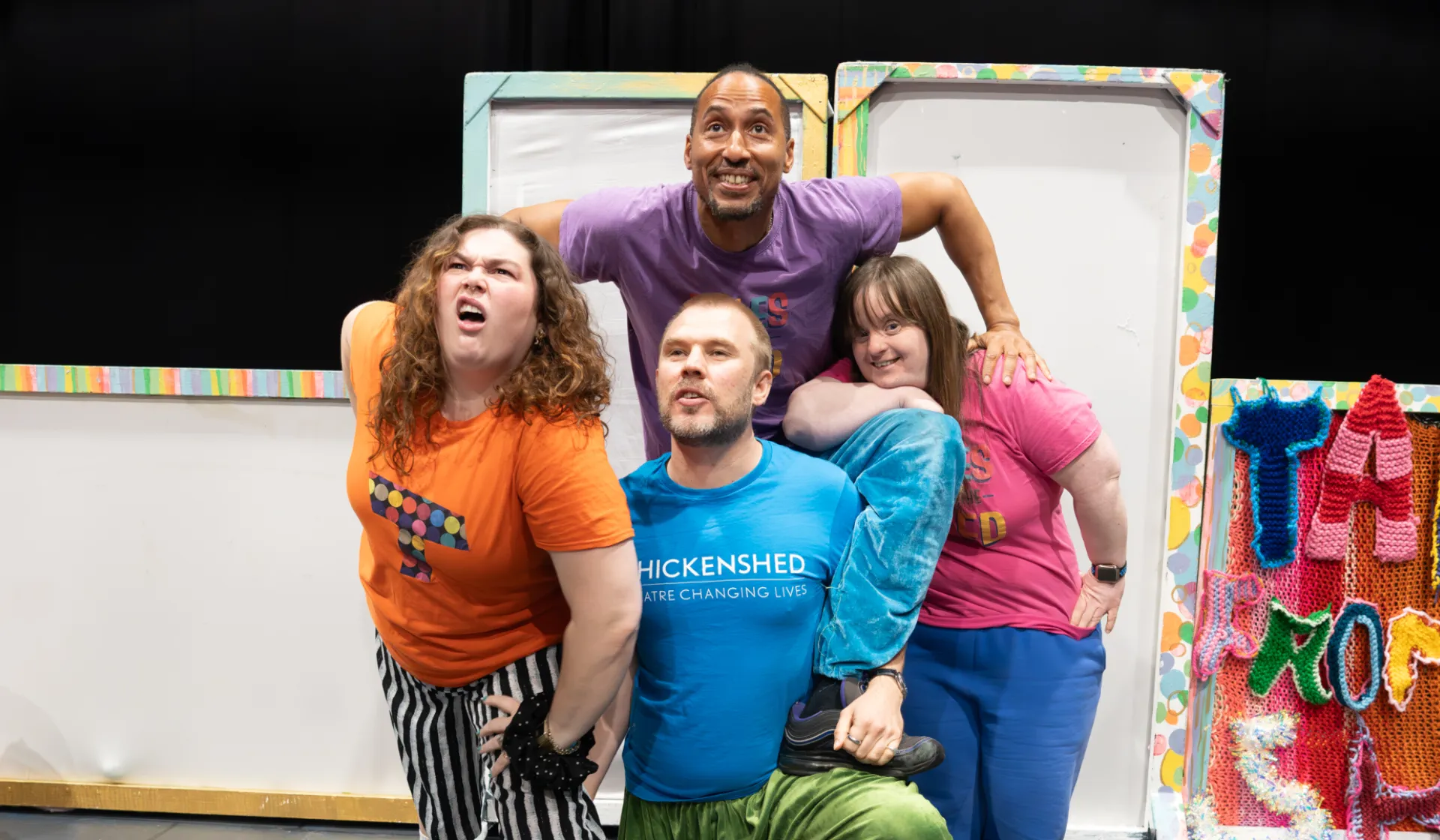 The tales from the shed team smiling on stage