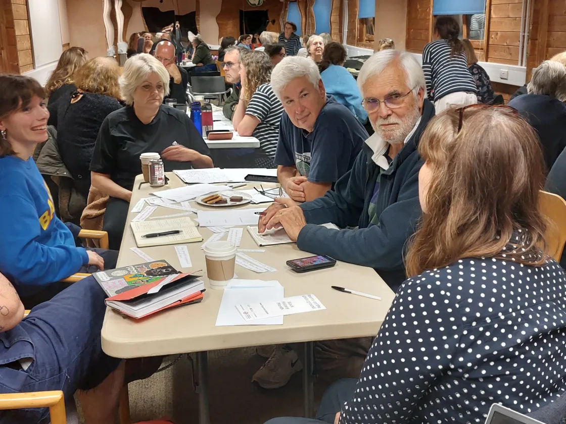 People sitting round tables talking