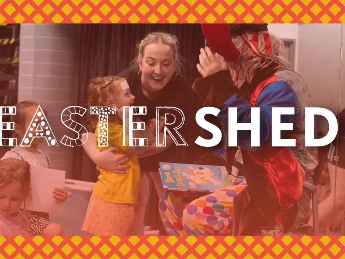 Easter Shed Hero Image. Orange hue, children playing with a jester