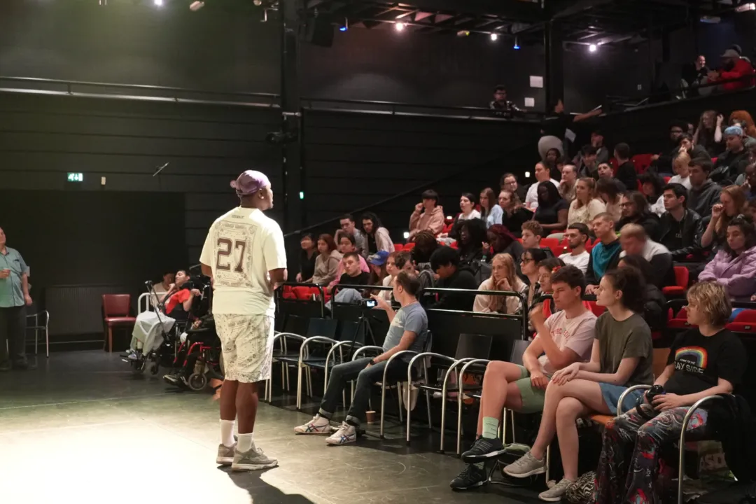 Michael delivers speech to new students in theatre