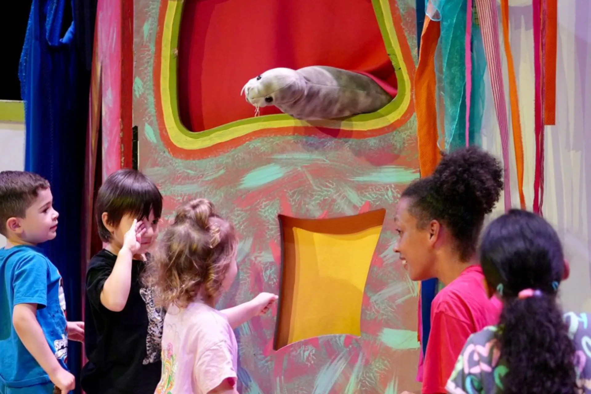 Children playing with puppets