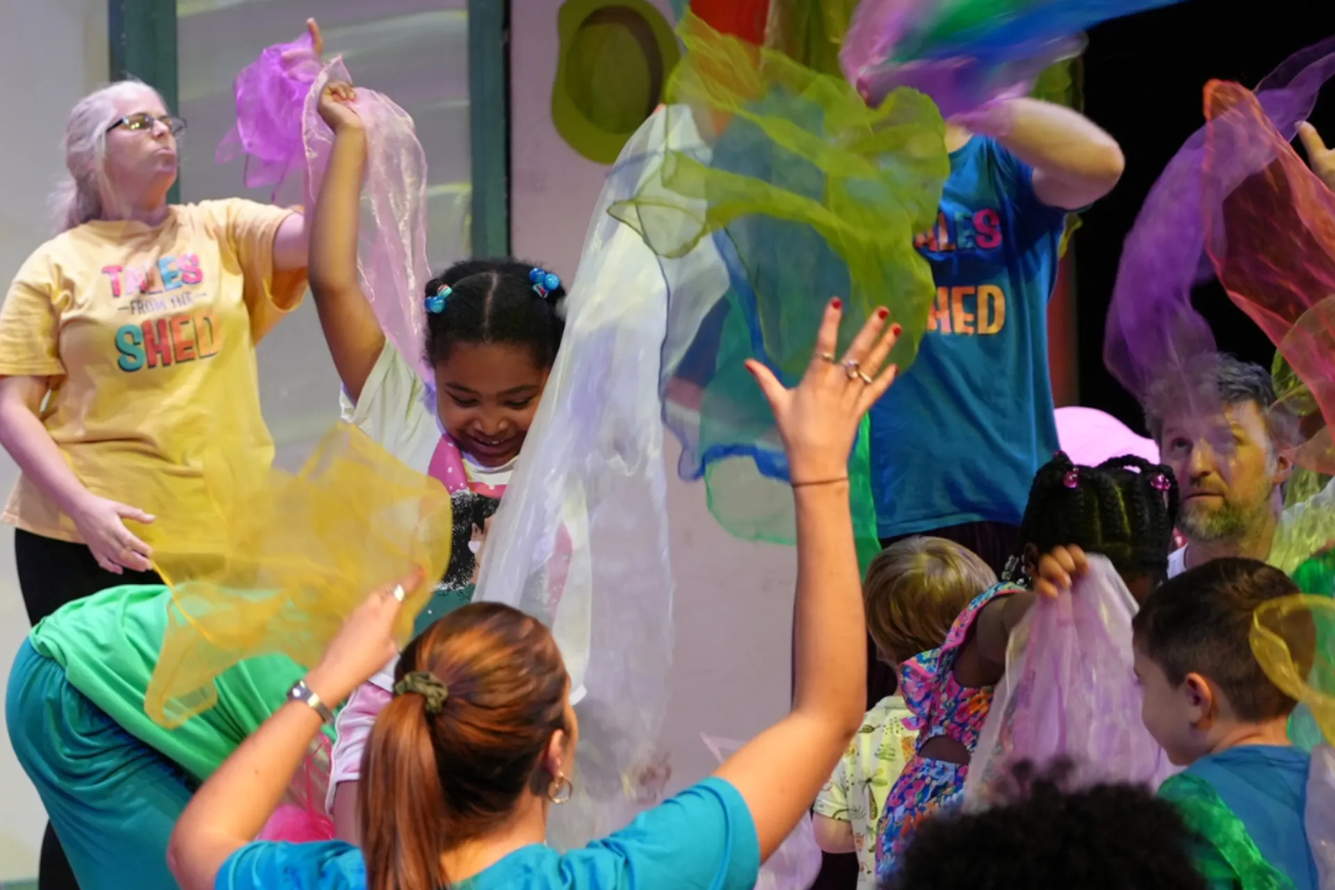 Children throwing silk fabric