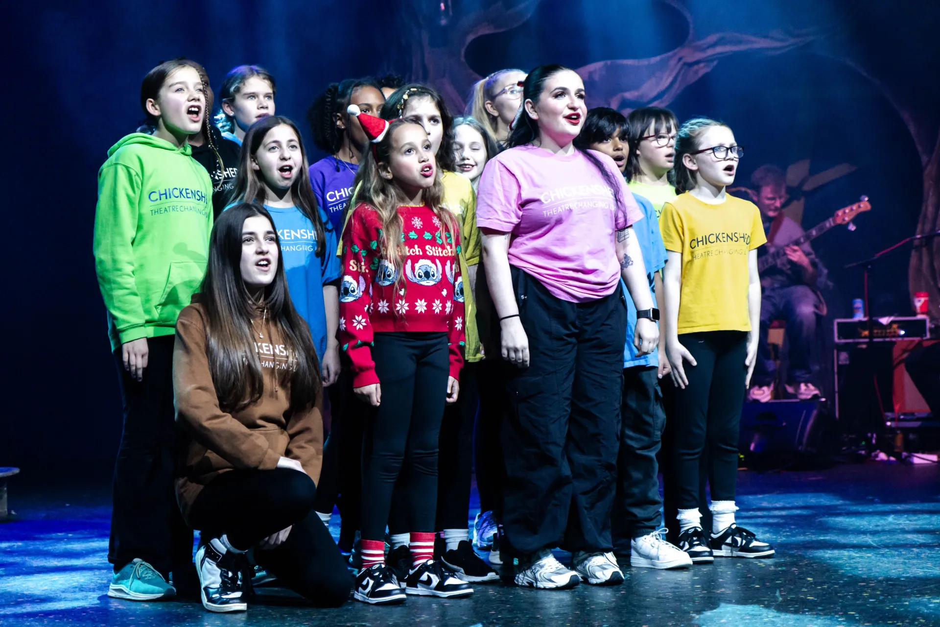 group sining in chritsmas jumpers