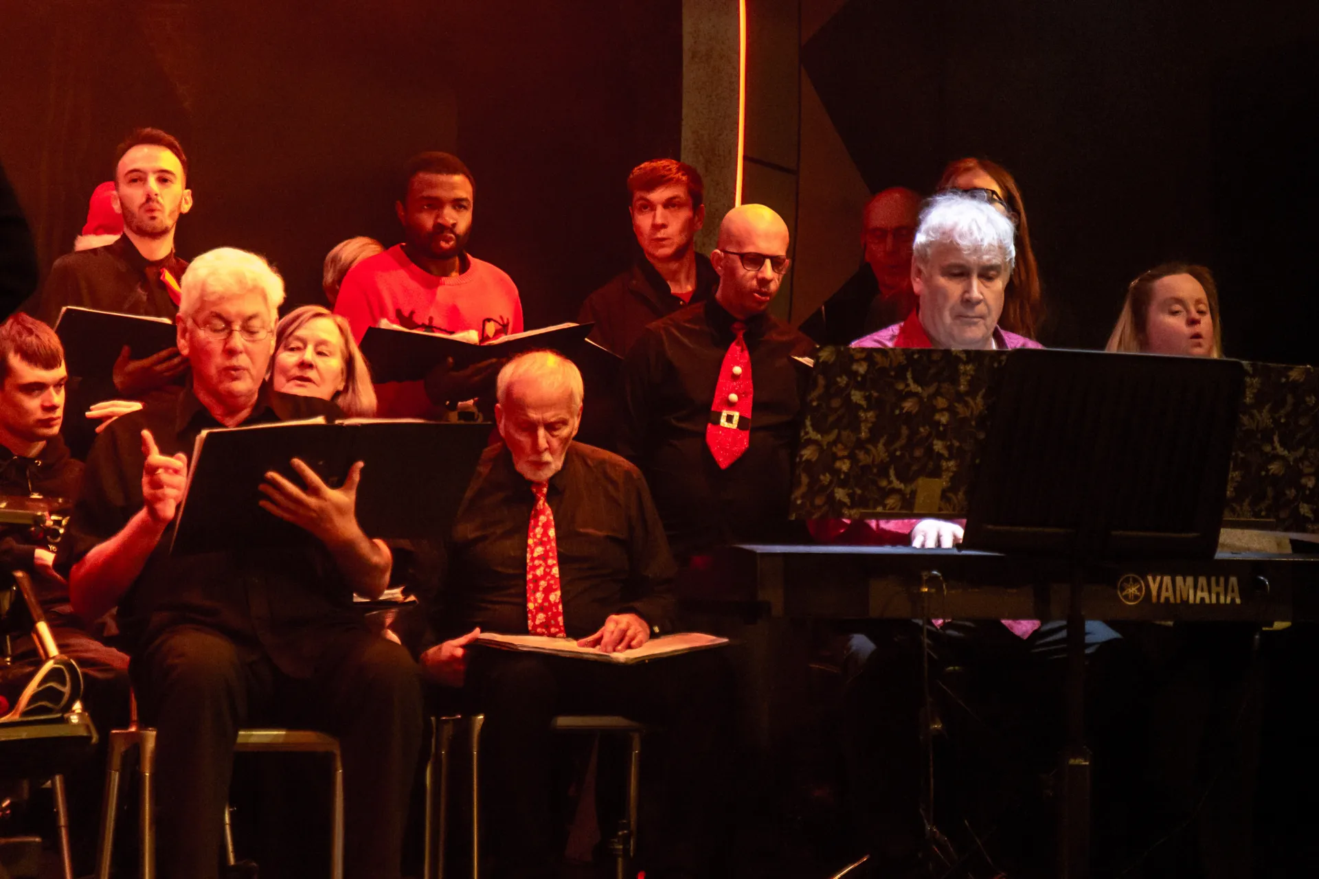 Choir singing in santa hats