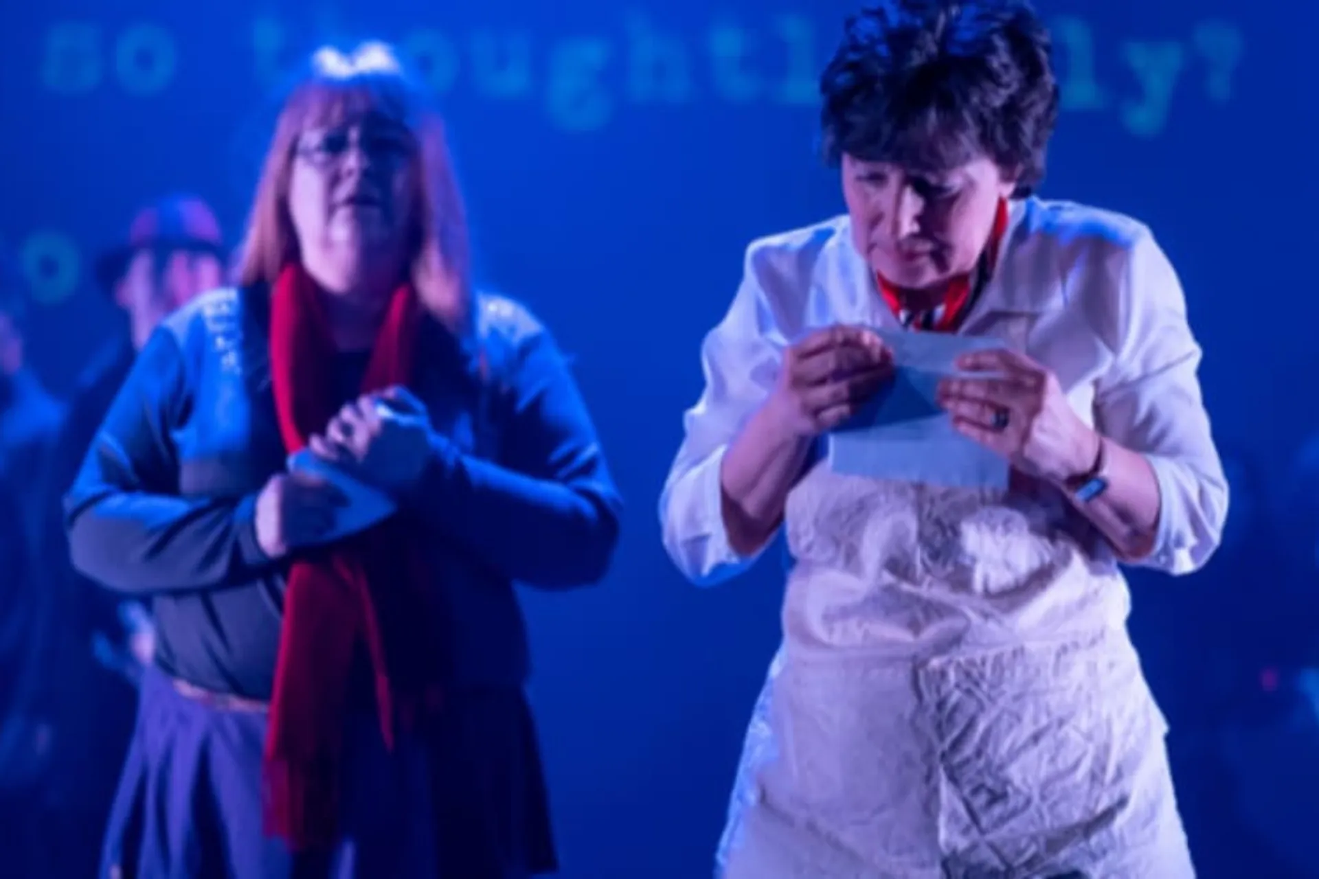 two performers acting on stage